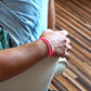 Lifestyle-Aufnahme: Handgefertigtes Armband Luise in Pink, TRAUNSEE Kollektion von SeaKing